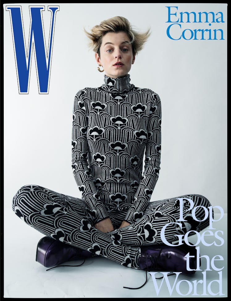 Emma Corrin wears a Prada jumpsuit and shoes; Cartier earring.