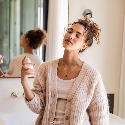 Model posing with Oak Essentials mist