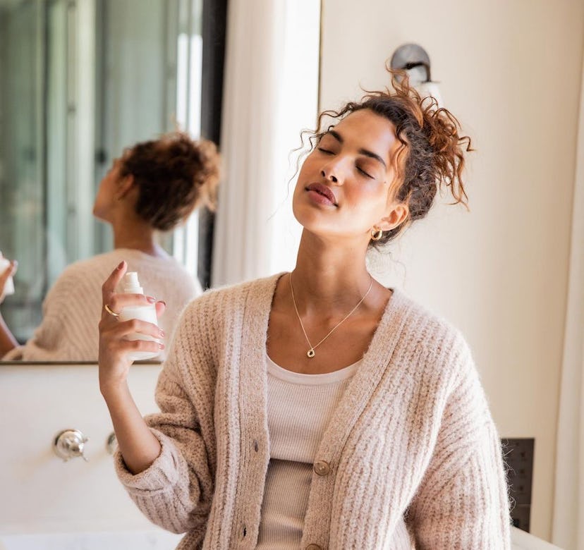 Model posing with Oak Essentials mist