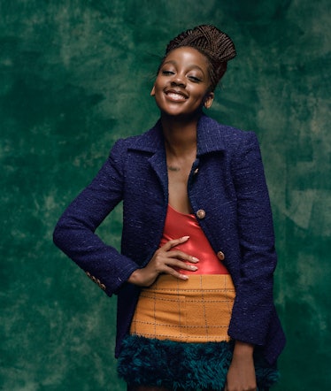 Thuso Mbedu wears a Saint Laurent by Anthony Vaccarello jacket, bodysuit, and miniskirt.