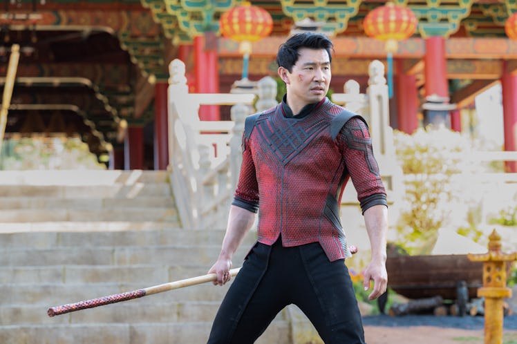 Simu Liu as Chang-Shi wielding a sword 