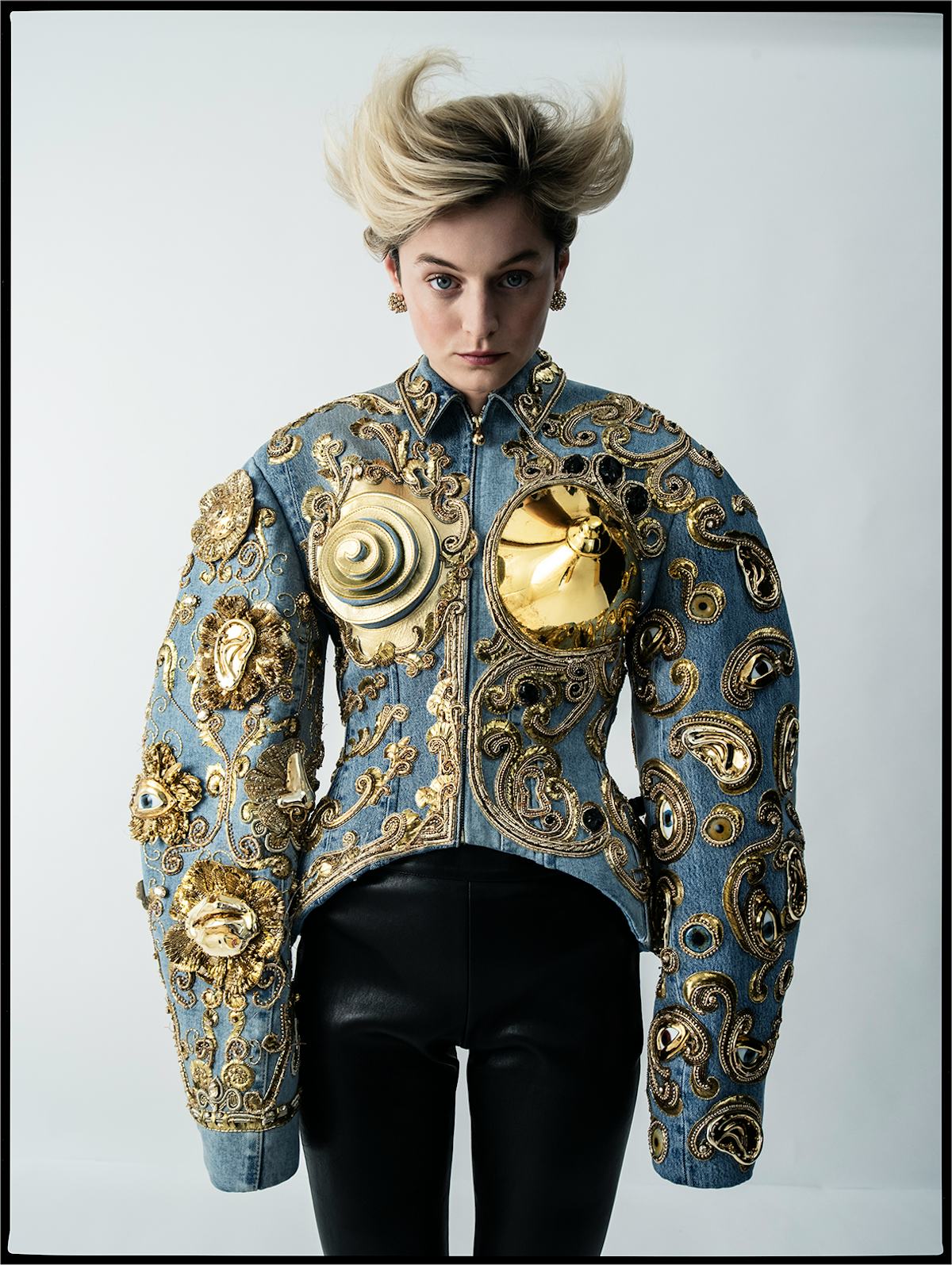 Emma Corrin wears a Schiaparelli Haute Couture jacket and pants; Cartier earrings.