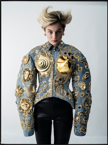 Emma Corrin wears a Schiaparelli Haute Couture jacket and pants; Cartier earrings.