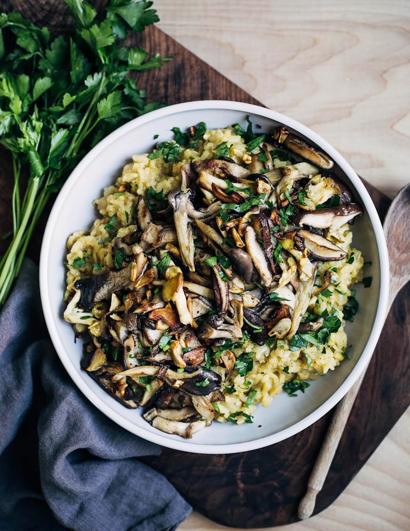 instant pot risotto topped with crispy mushrooms, served in a white bowl