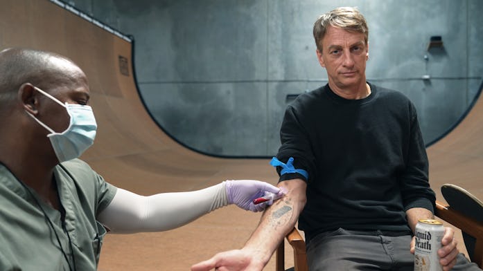 Tony Hawk giving blood for his blood-infused Liquid Death skateboard