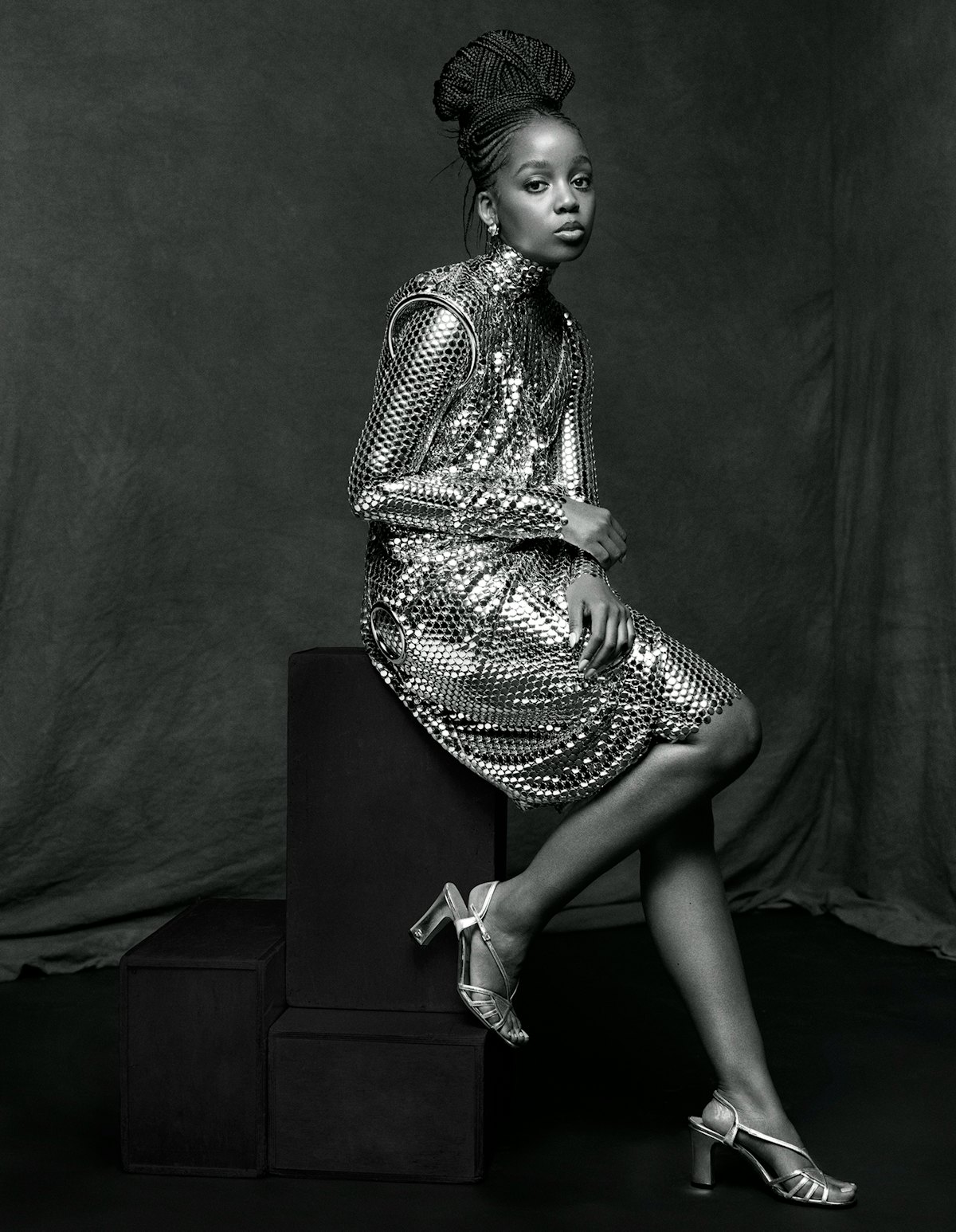 Thuso Mbedu wears a Burberry dress and bodysuit; Prounis earrings; Gucci sandals.
