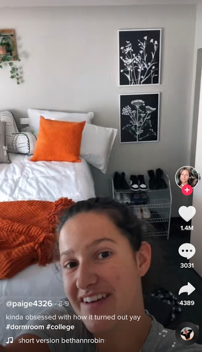 A girl reveals her dorm room decor in a POV TikTok video. 