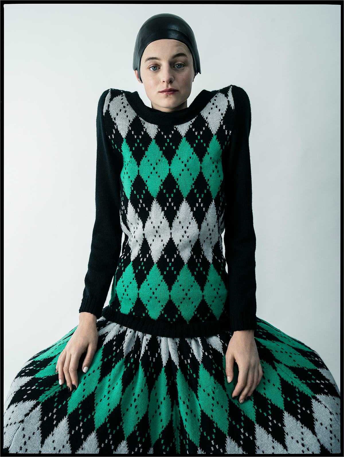 Emma Corrin wears a Laura Andraschko dress; Jo Miller Studio hat.