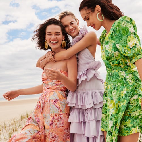 Models wearing floral dresses in Rent The Runway's April 2021 editorial.