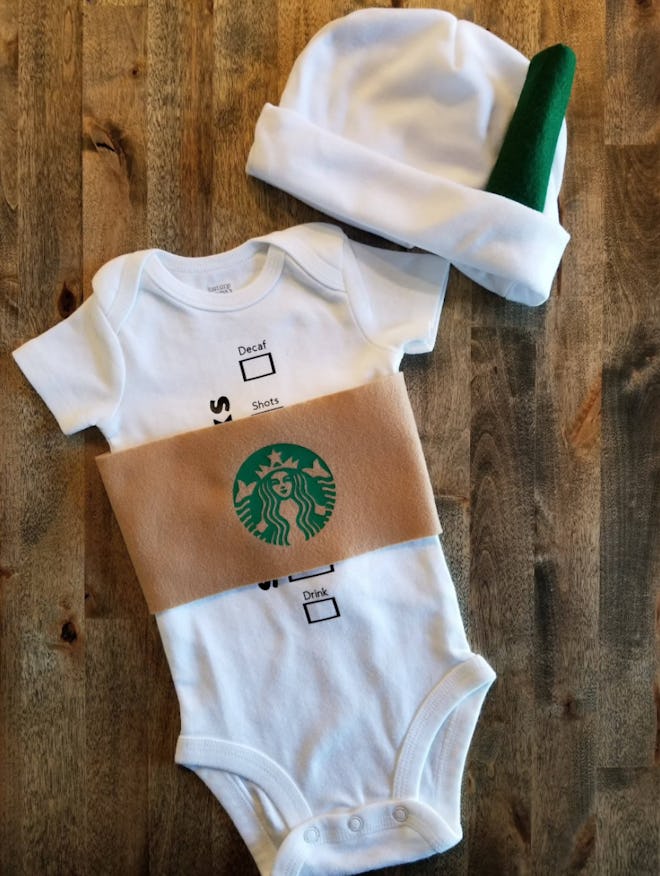 Flat-lay of a baby onesie and hat designed to look like a Starbucks coffee cup