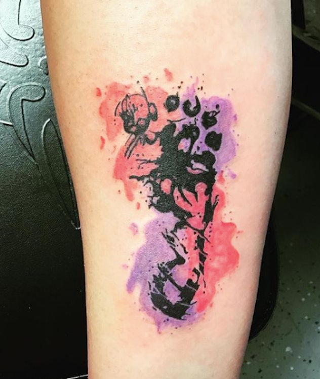 A pink and purple baby footprint tattoo