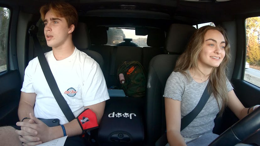 Zoey Watson and Grayson Leavy driving together on 'Titletown High'.