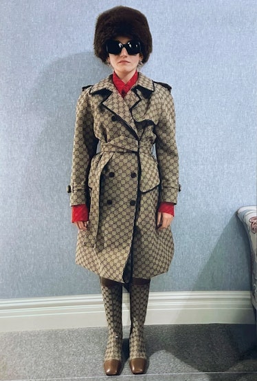 Julia Garner channeling Catherine Deneuve in a trenchcoat.