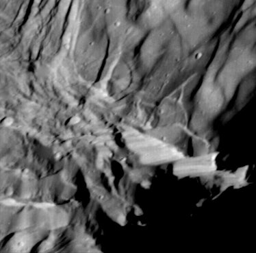 Verona Rupes, about 50 km (31 miles) long and several km high, but not actually so cliff-like as it ...