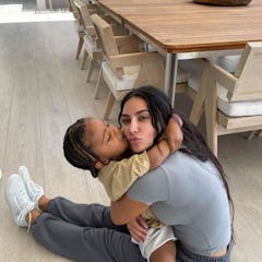 Kim Kardashian shares a kiss with her son, Saint. 