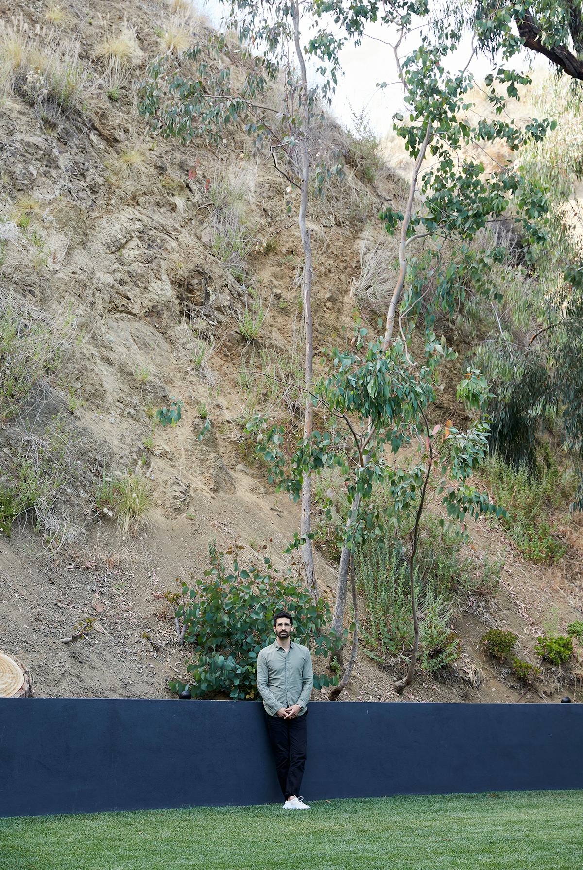 Kordansky in his backyard, against the hills of Griffith Park.