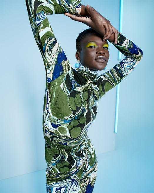 A model in a green jumpsuit from the Target Fall Designer Collection