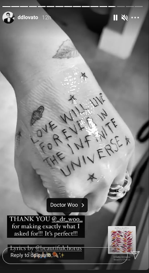 A close up on Demi Lovato's new hand tattoo which was inspired by Beautiful Chorus' "Infinite Univer...