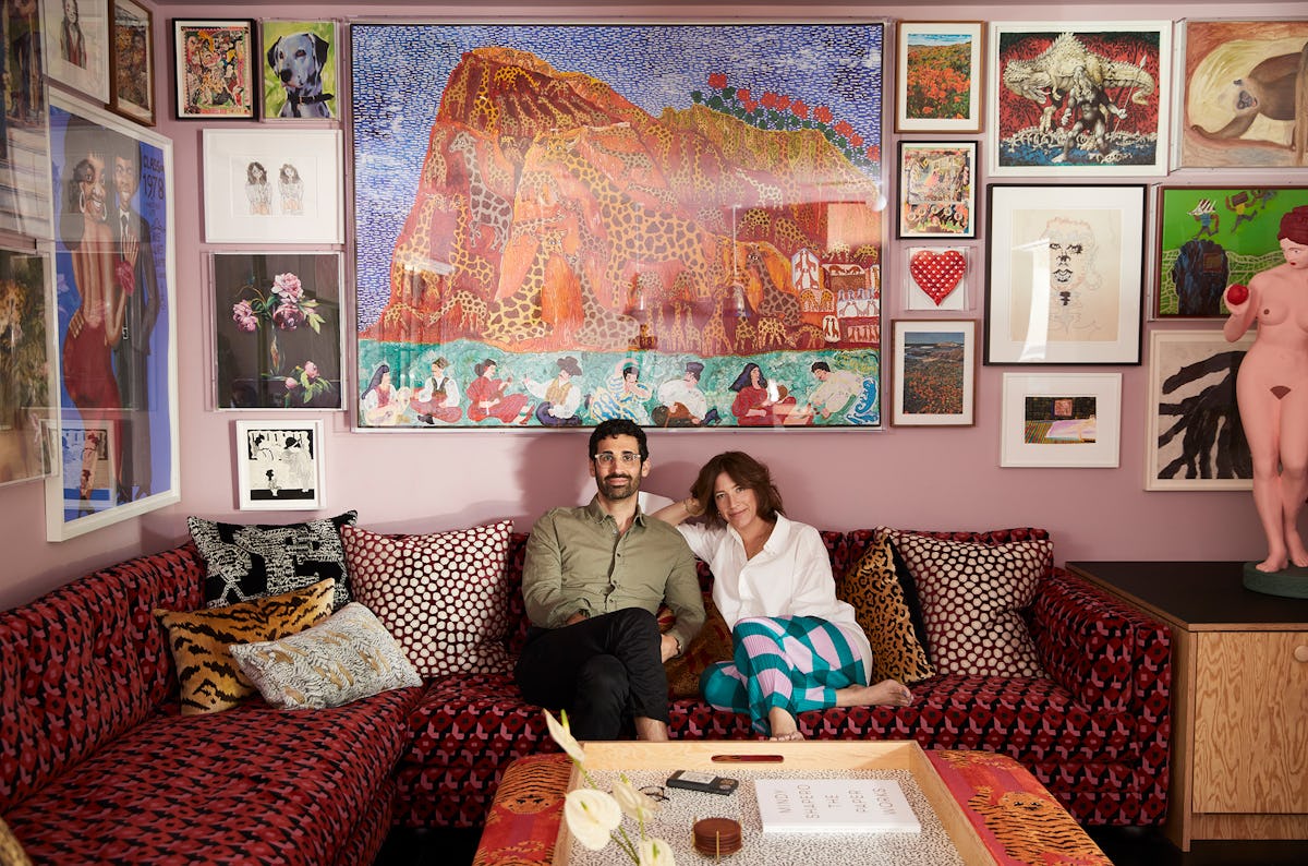 Kordansky  and Shapero in the TV room, beneath Maija Peeples-Bright’s Giraffe Gibraltar With Gecko G...