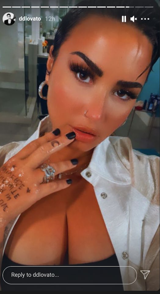 Demi Lovato showing off their new tattoo inspired by Beautiful Chorus' song "Infinite Universe."