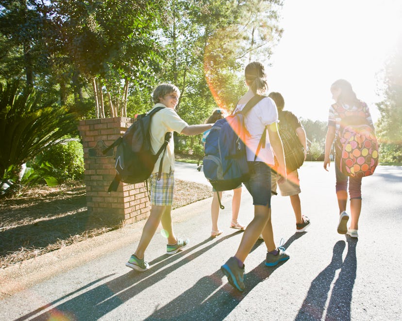 group of kids walking wearing colorful backpacks
