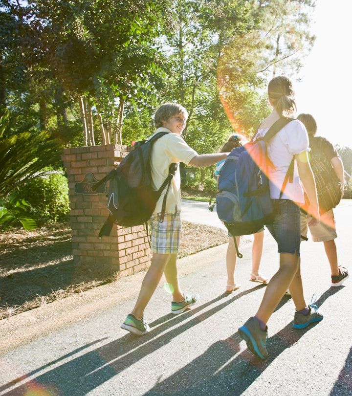 group of kids walking wearing colorful backpacks