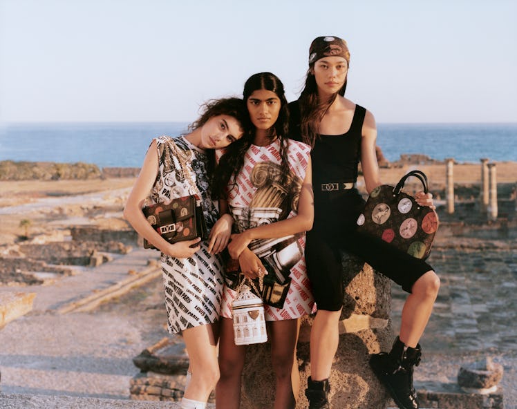 Three models posing for Louis Vuitton x Fornasetti