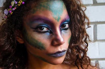 Young woman with mermaid makeup in need of mermaid quotes for Instagram captions.