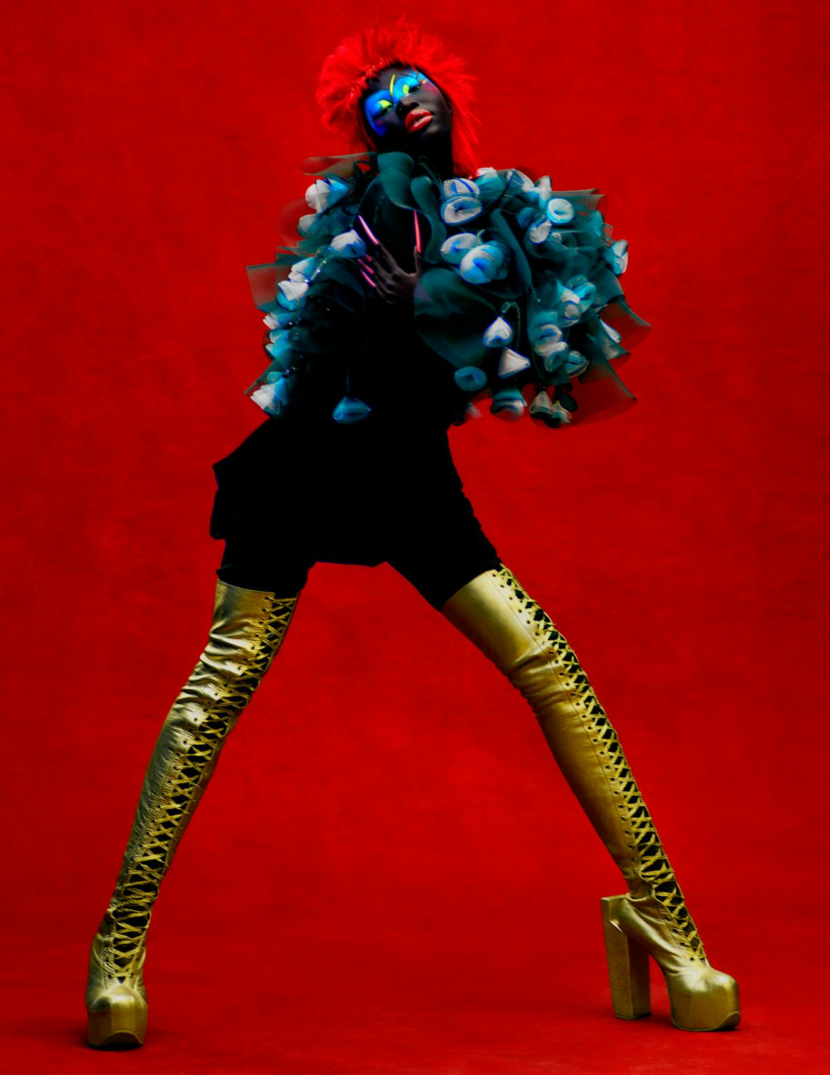 Adhel Bol wears a Giorgio Armani cape and skirt; Natacha Marro boots.