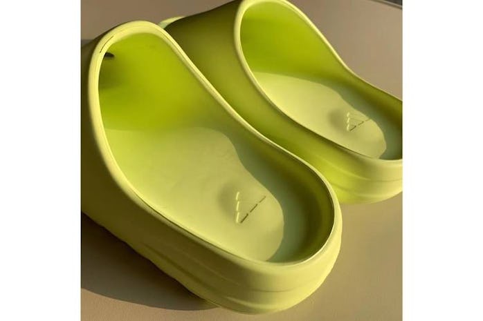 Kanye West Yeezy slides glow green