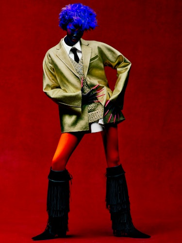Adhel Bol wears a Valentino jacket, sweater, and shirt; Roger Vivier boots; stylist’s own tie.