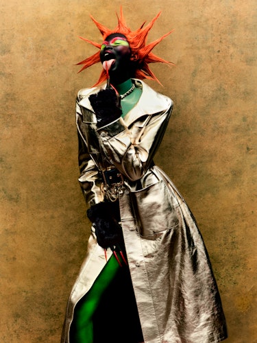 Adhel Bol wears a Chanel coat, necklace, and gloves; Atsuko Kudo top; Schiaparelli belt.