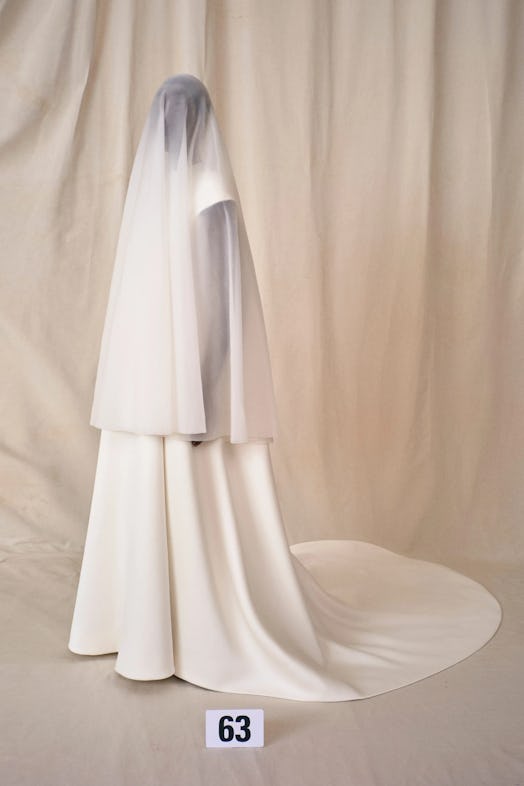 Model wears a wedding dress from Balenciaga Couture Fall 2021 collection.