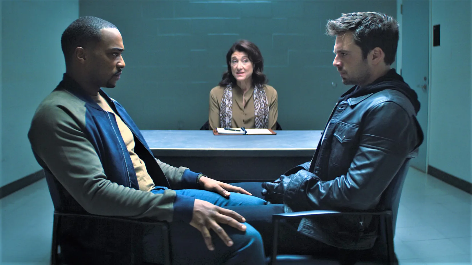 The Falcon and the Winter Soldier’s Sam Wilson and Bucky Barnes sitting opposite each other in thera...