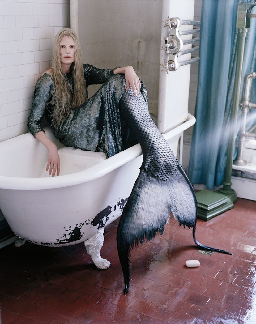 Kristen McMenamy posing as a mermaid in an iconic shoot for W magazine