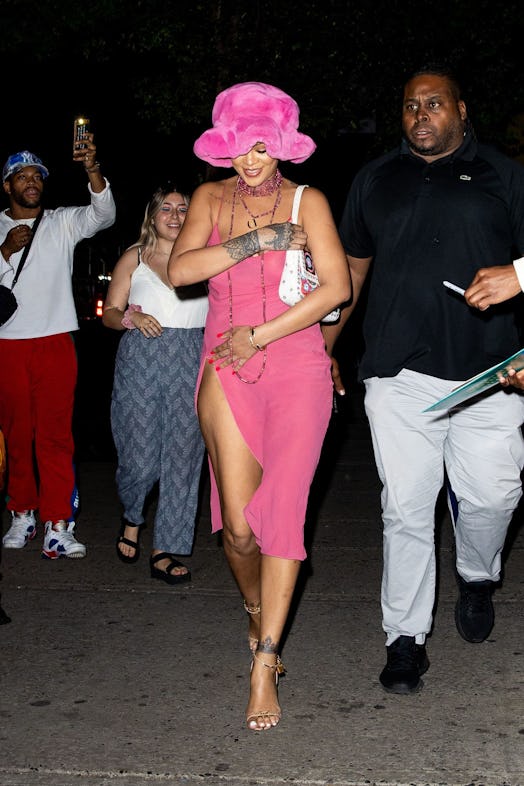 Rihanna wearing a pink bucket hat