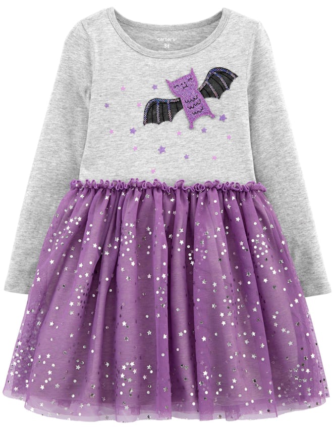 Image of a toddler dress with a bat on its top, and a purple tutu skirt bottom.