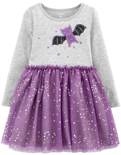 Image of a toddler dress with a bat on its top, and a purple tutu skirt bottom.