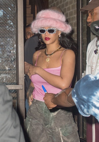 Rihanna Pairs a Pink Fur Bucket Hat with Camouflage Pants in NYC