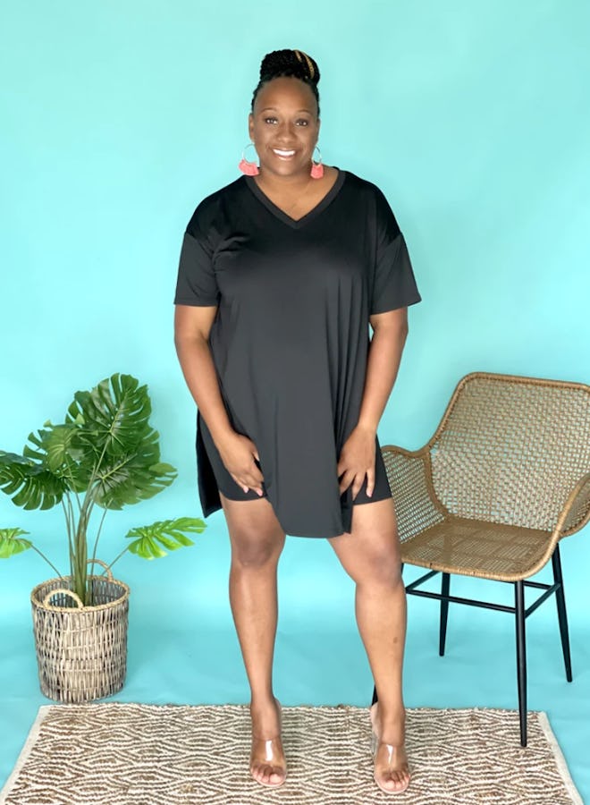 Woman standing; modeling black t-shirt dress