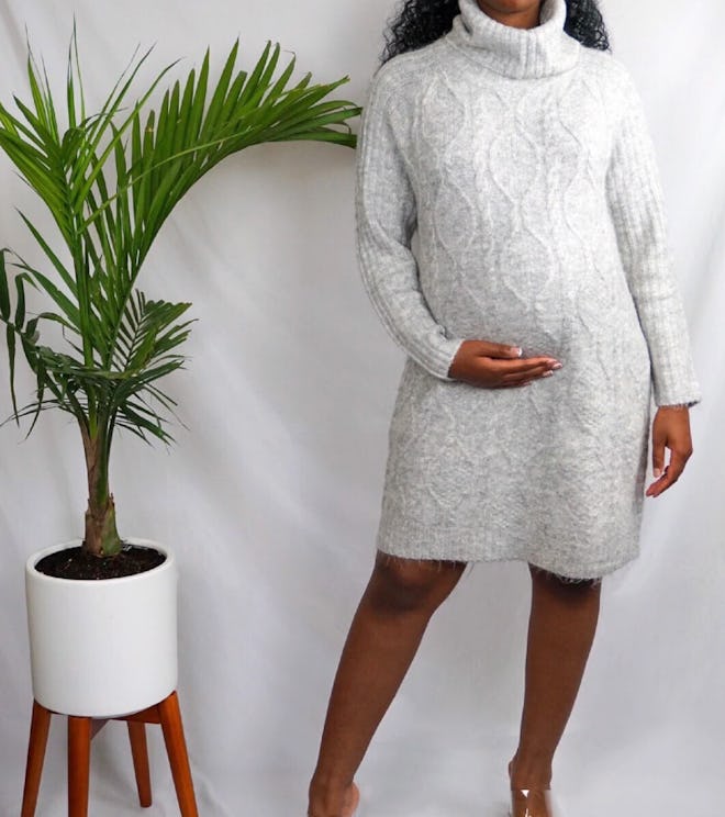 Woman modeling grey sweater dress