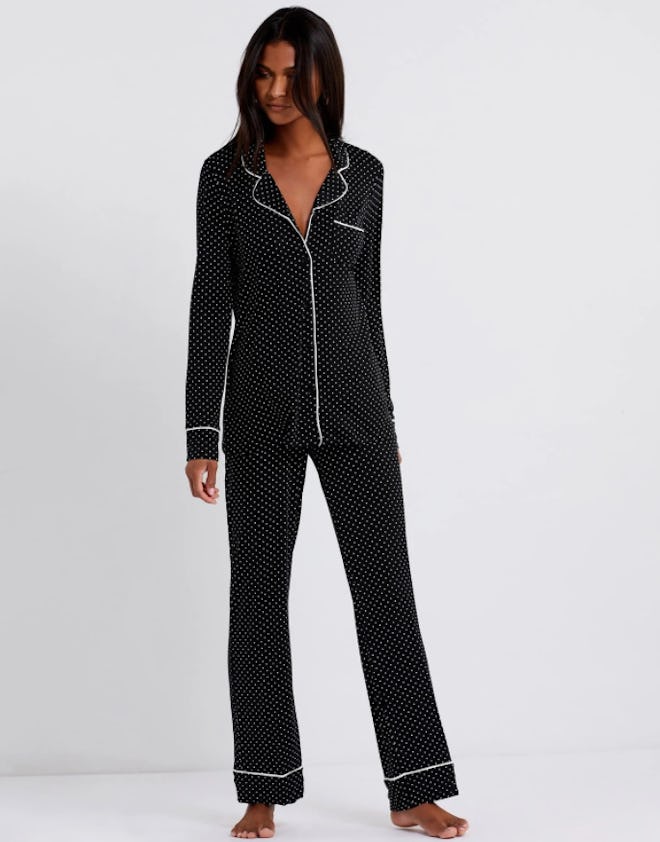 Woman modeling two-piece black pajama set