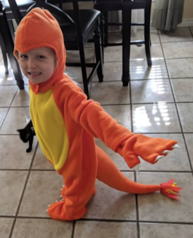 Child wearing a Charmander costume