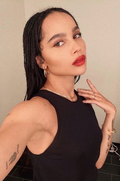 Zoe Kravitz wearing YSL's red lipstick and simple gold jewelry.