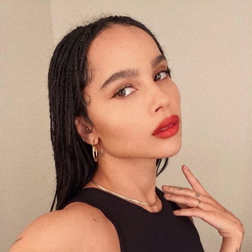 Zoe Kravitz wearing YSL's red lipstick and simple gold jewelry.