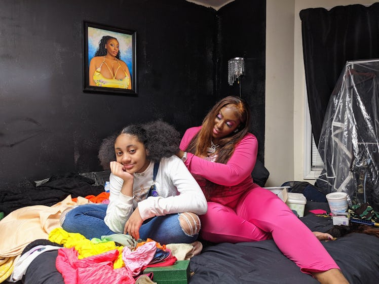 Photograph by Mayan Toledano, featuring Erica Diggs massaging her daughter's shoulders