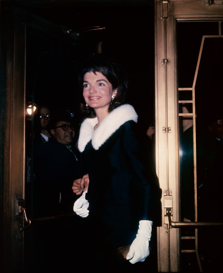 Jackie Kennedy wearing a coat with a fur ruff