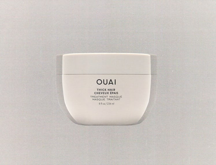 a tub of Ouai hair mask against a grey background