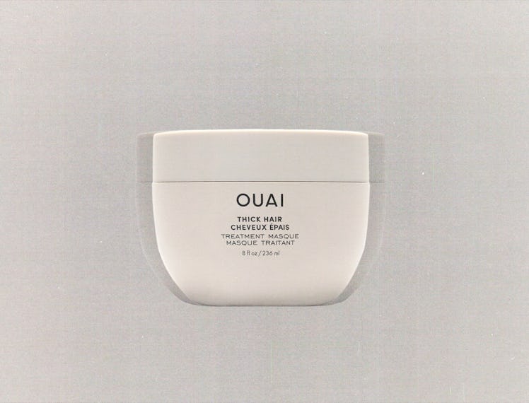 a tub of Ouai hair mask against a grey background