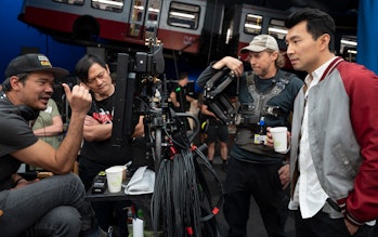 Director Destin Daniel Cretton and actor Simu Liu on the set of Shang-Chi and the Legend of the Ten ...